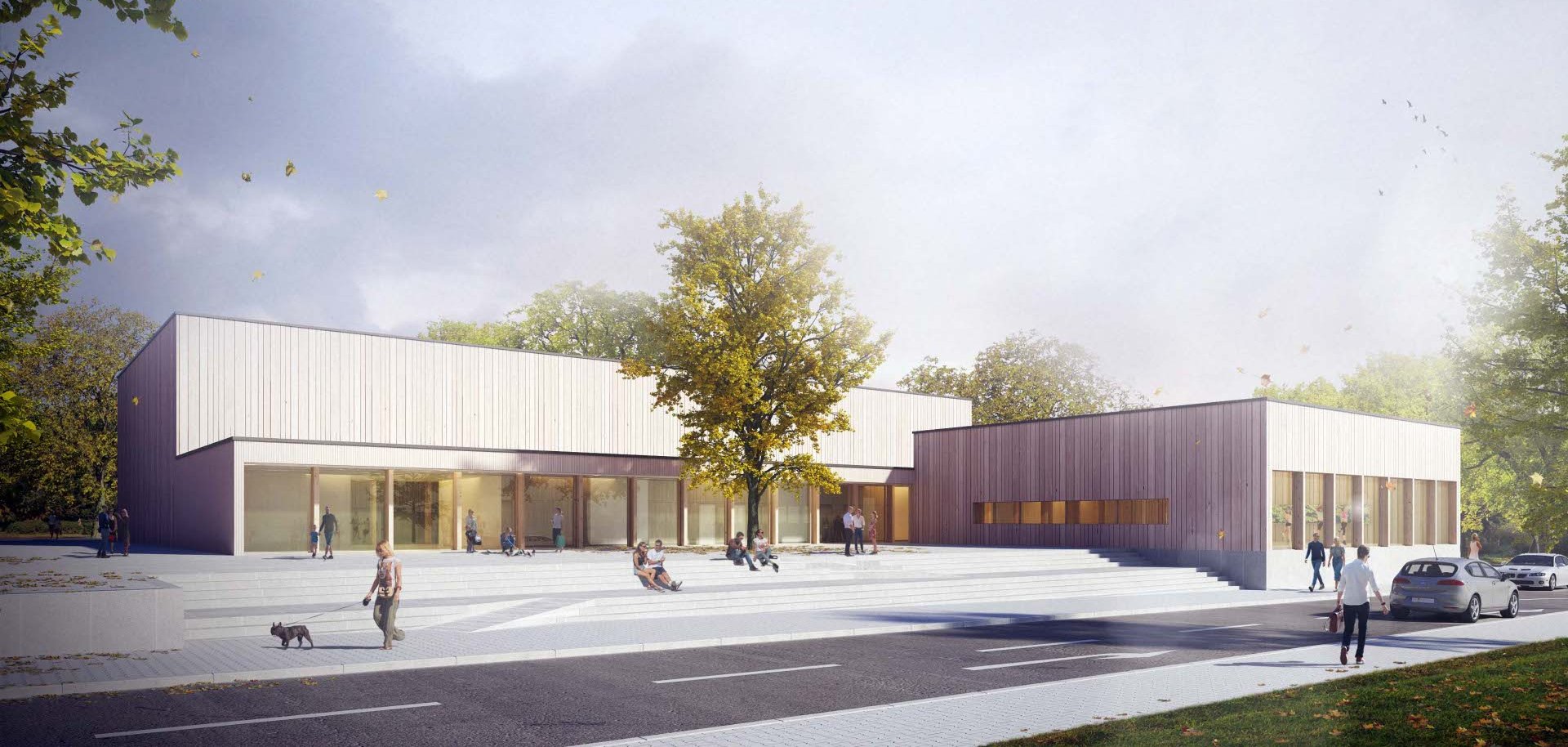 Auf dem Vorplatz zur neuen Zweifeldhalle in der Turnstraße soll ein Kunstwerk entstehen, das die Blicke auf sich zieht und zur Identität der Sportstätte beiträgt. Visualisierung eines modernen, flachen Gebäudekomplexes mit großen Glasfronten und Holzfassade. Vor dem Gebäude befindet sich ein großzügiger Platz mit breiten Treppen, auf dem mehrere Personen sitzen, gehen oder einen Hund ausführen. Ein einzelner Baum steht zentral vor dem Gebäude, und im Vordergrund verläuft eine Straße mit parkenden Autos.