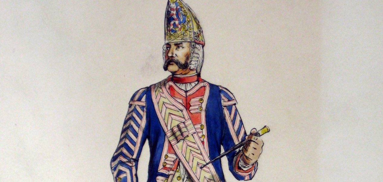 Fritz Kredel, einer der bedeutendsten Buchillustratoren des 20. Jahrhunderts, hat die landgräfliche Infanterie in Zeichnungen festgehalten – etwa hier den Tambour der 1. Leibkompagnie. Historische Illustration eines Tambours der „1. Leib-Kompagnie“ in farbenfroher Uniform mit Trommel und kunstvoll verziertem Helm. Die Zeichnung zeigt einen militärischen Musiker aus vergangener Zeit mit detaillierter Kleidung und traditioneller Ausrüstung.