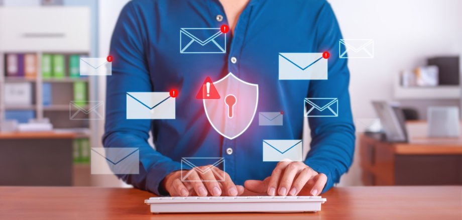 Businessman Managing Cybersecurity Threats with Antivirus Protection in Email System