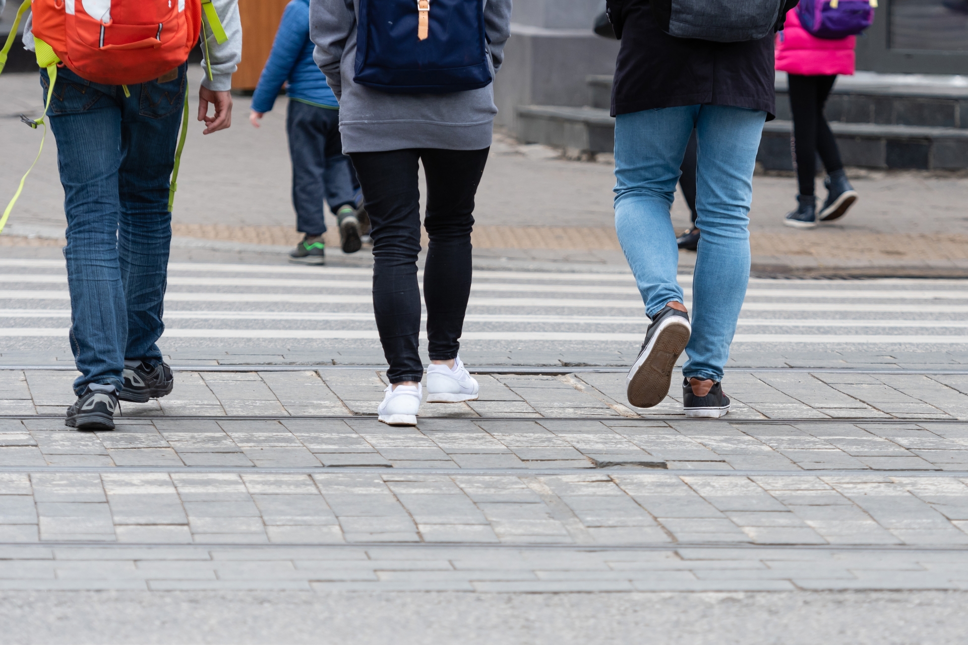 Feet of pedestrians walking on the crosswalk - image Feet of pedestrians walking on the crosswalk - image