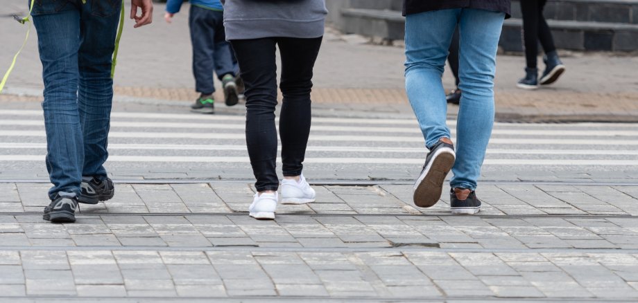 Feet of pedestrians walking on the crosswalk - image Feet of pedestrians walking on the crosswalk - image